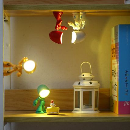 LED Stolní lampa LED/0,06W/3xLR41 robot žlutá