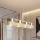 Lustr na lanku LUX 4xE27/15W/230V bílá/zlatá